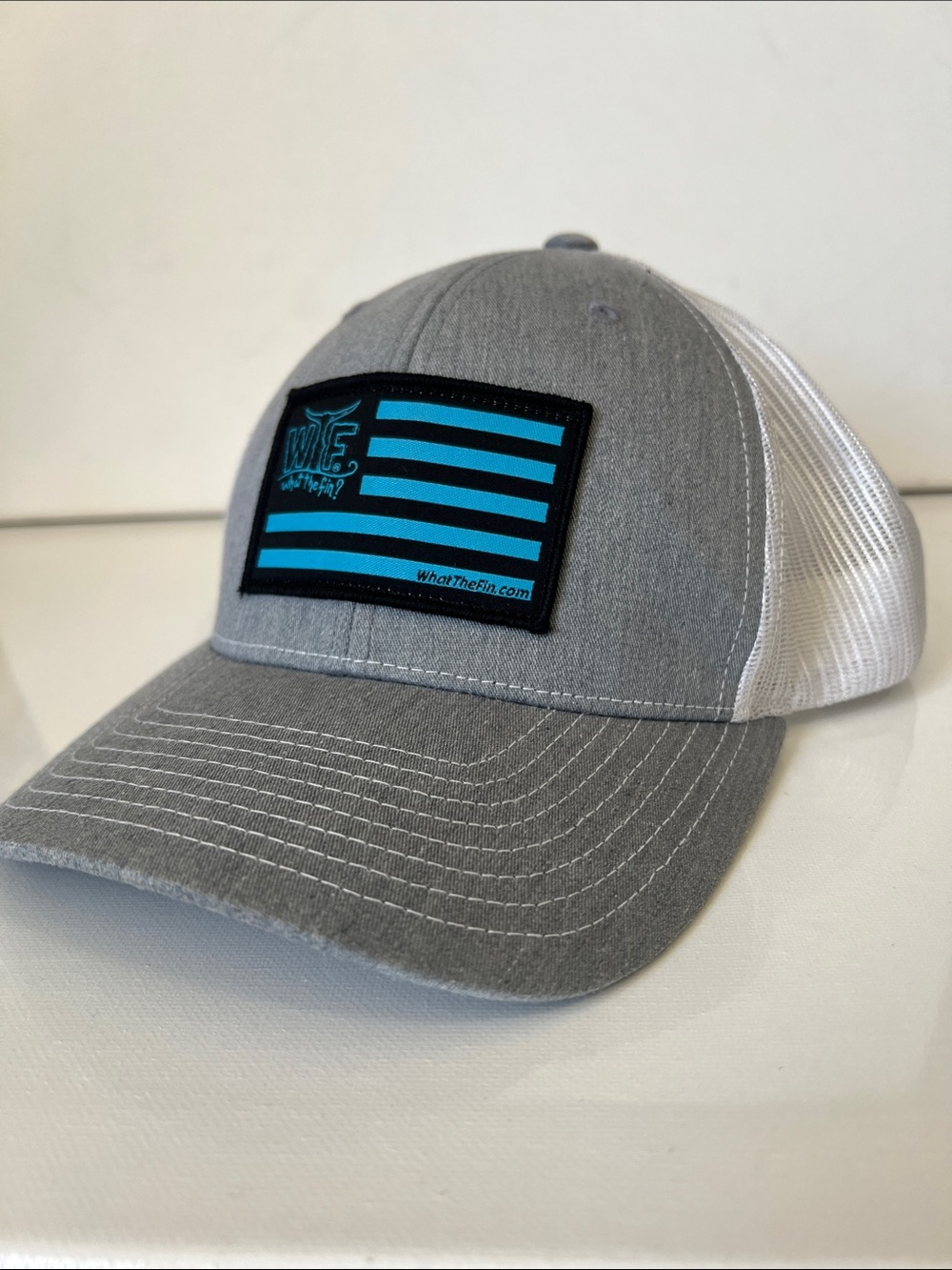 WTF What The Fin? Grey & Blue Patch Trucker Hat